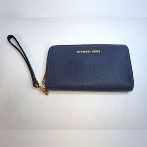 Navy Michael Kors wallet/wristlet with gold hardware.
